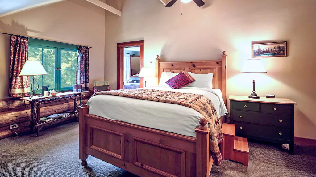 historic lodge room with queen bed main