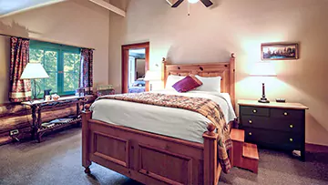 historic lodge room with queen bed mobile