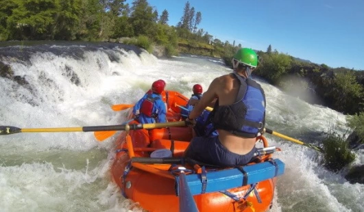 Whitewater rafting through Nugget Falls rapids on the Rogue River near Grants Pass, Oregon.